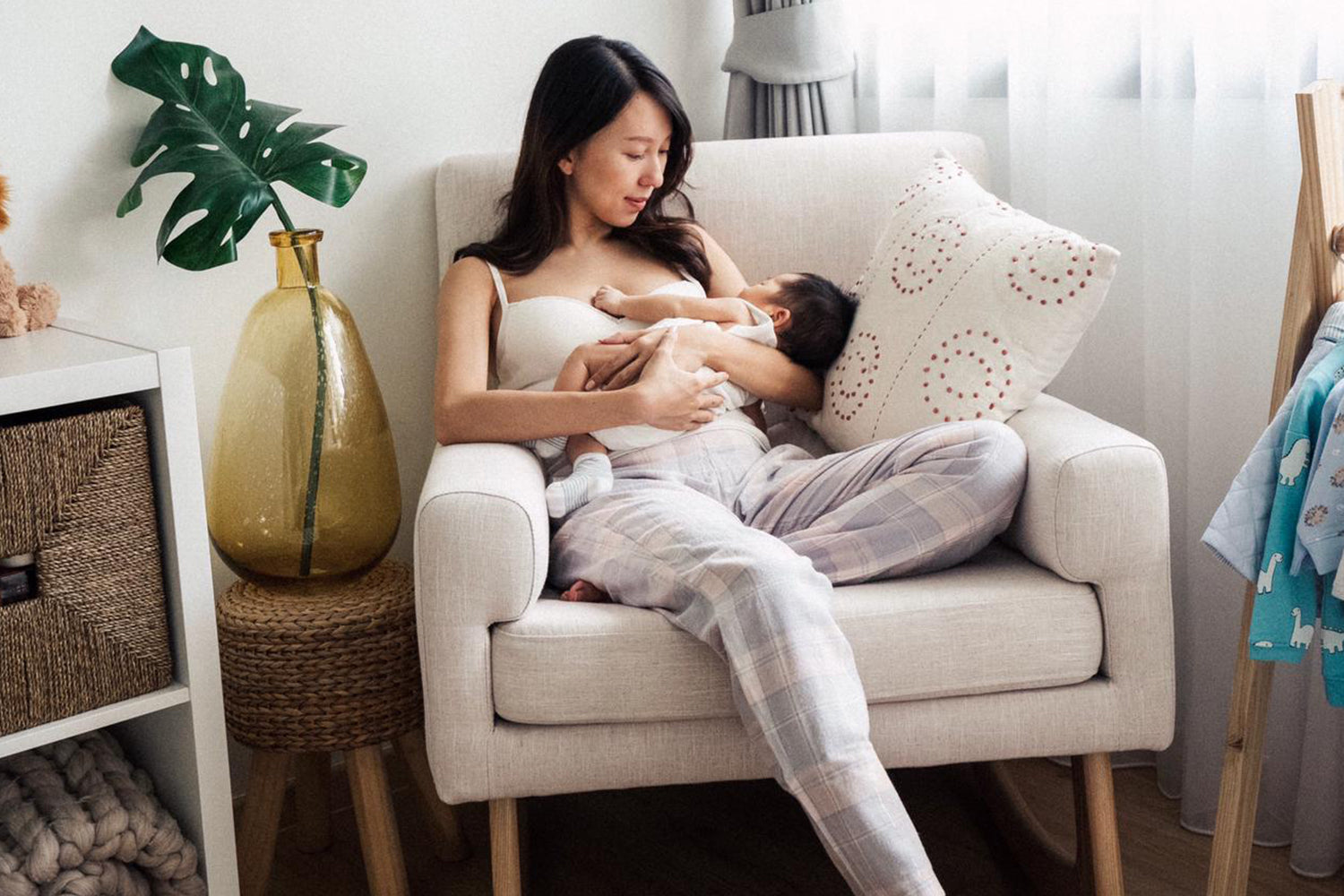 mum soothing baby to sleep on Sleepytime nursing chair