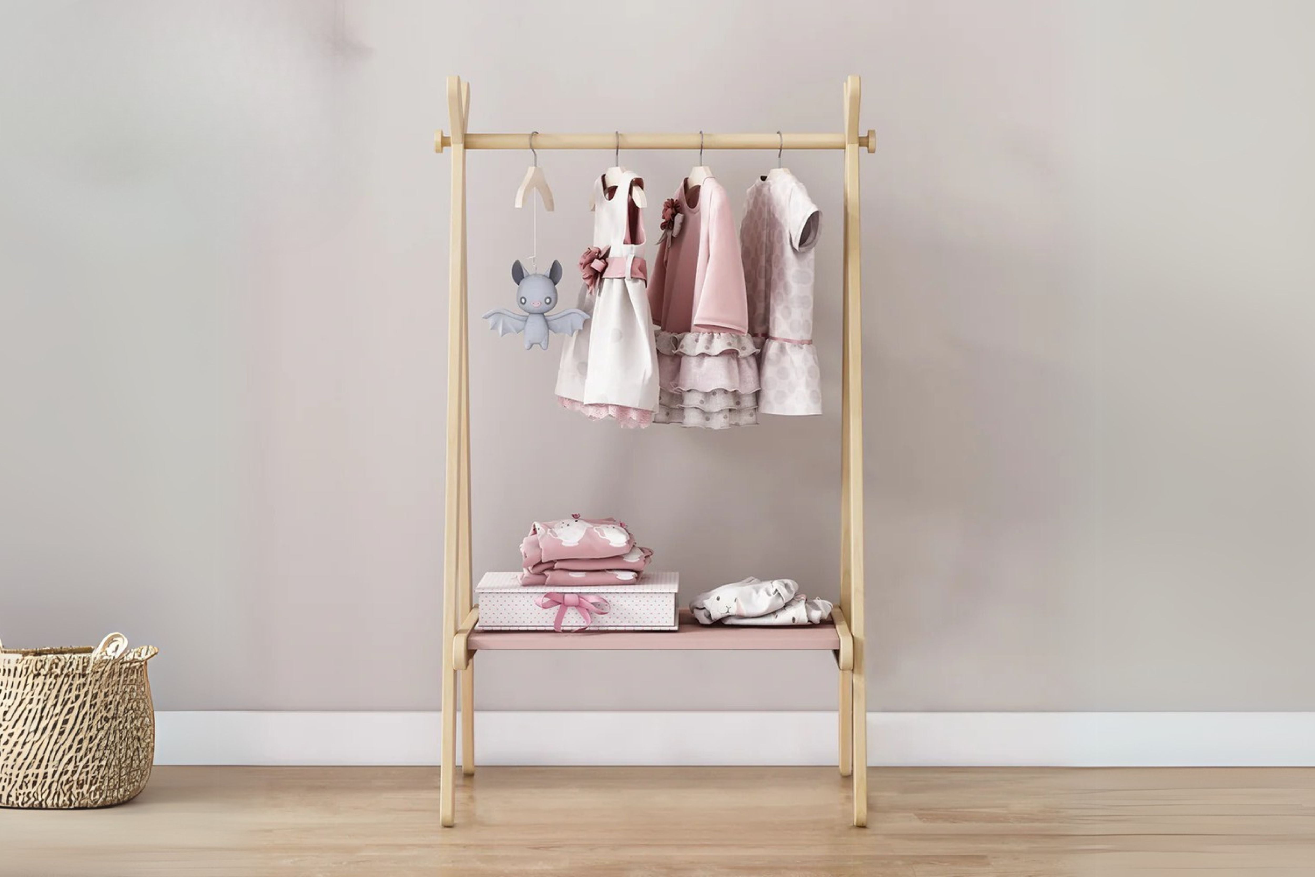 Boori Forest Clothing Rack displayed in the middle of a cosy nursery room setting