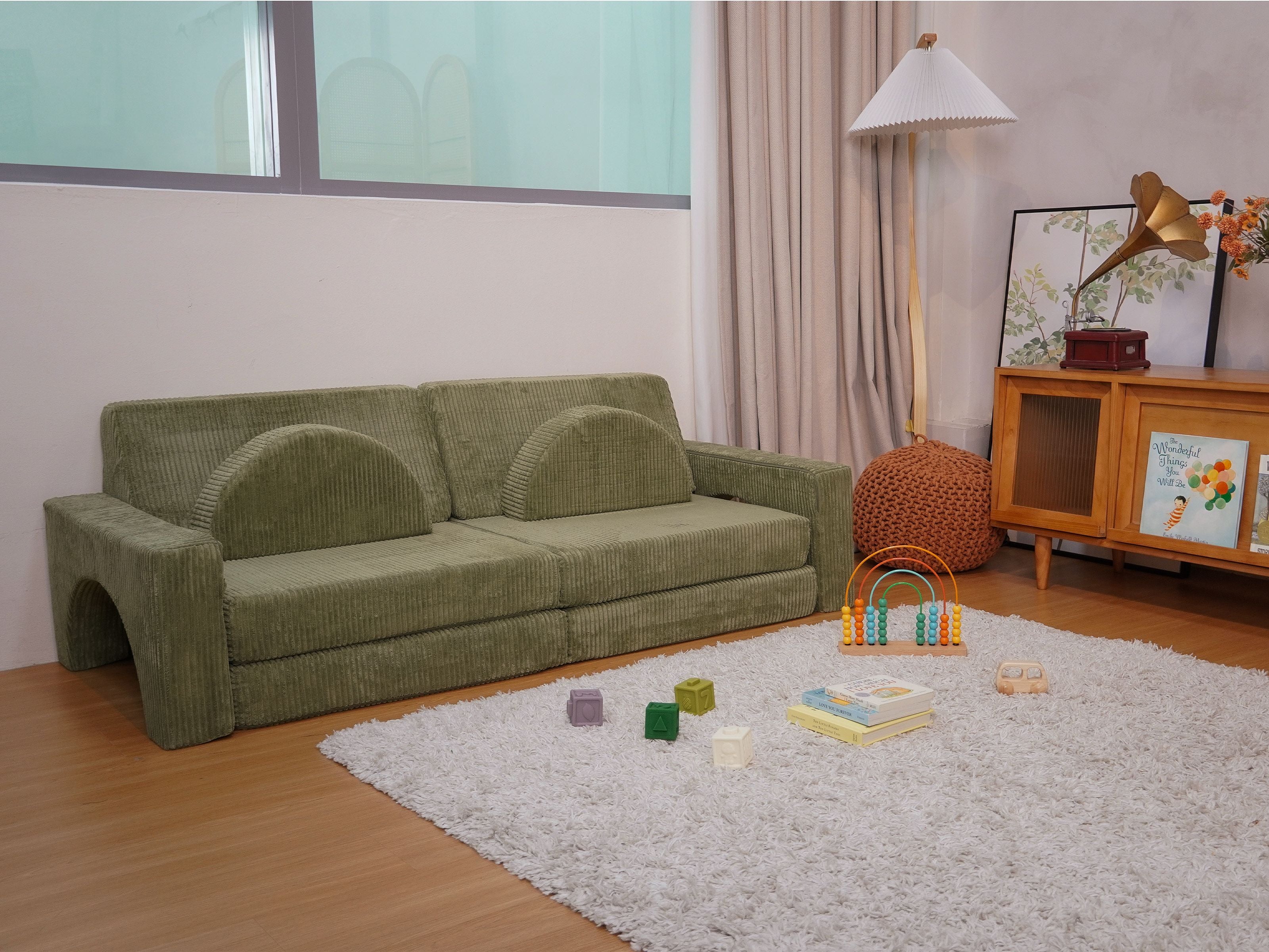 Lollibly Wonderstack Play Sofa in Fern displayed in a cosy nursery room setting