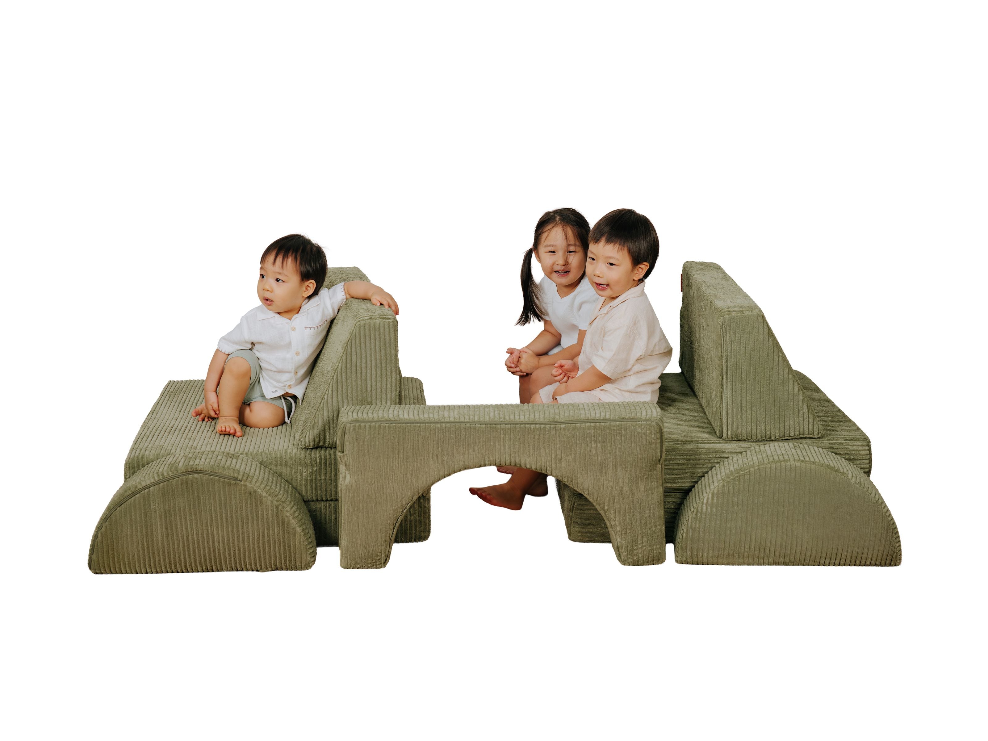 Toddlers and kids seated on the Lollibly Wonderstack Play Sofa, in a configuration mimicking a car