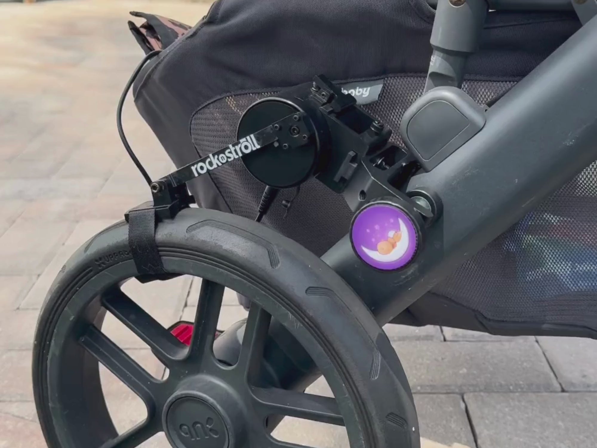video of parent using rocknstroll stroller accessory