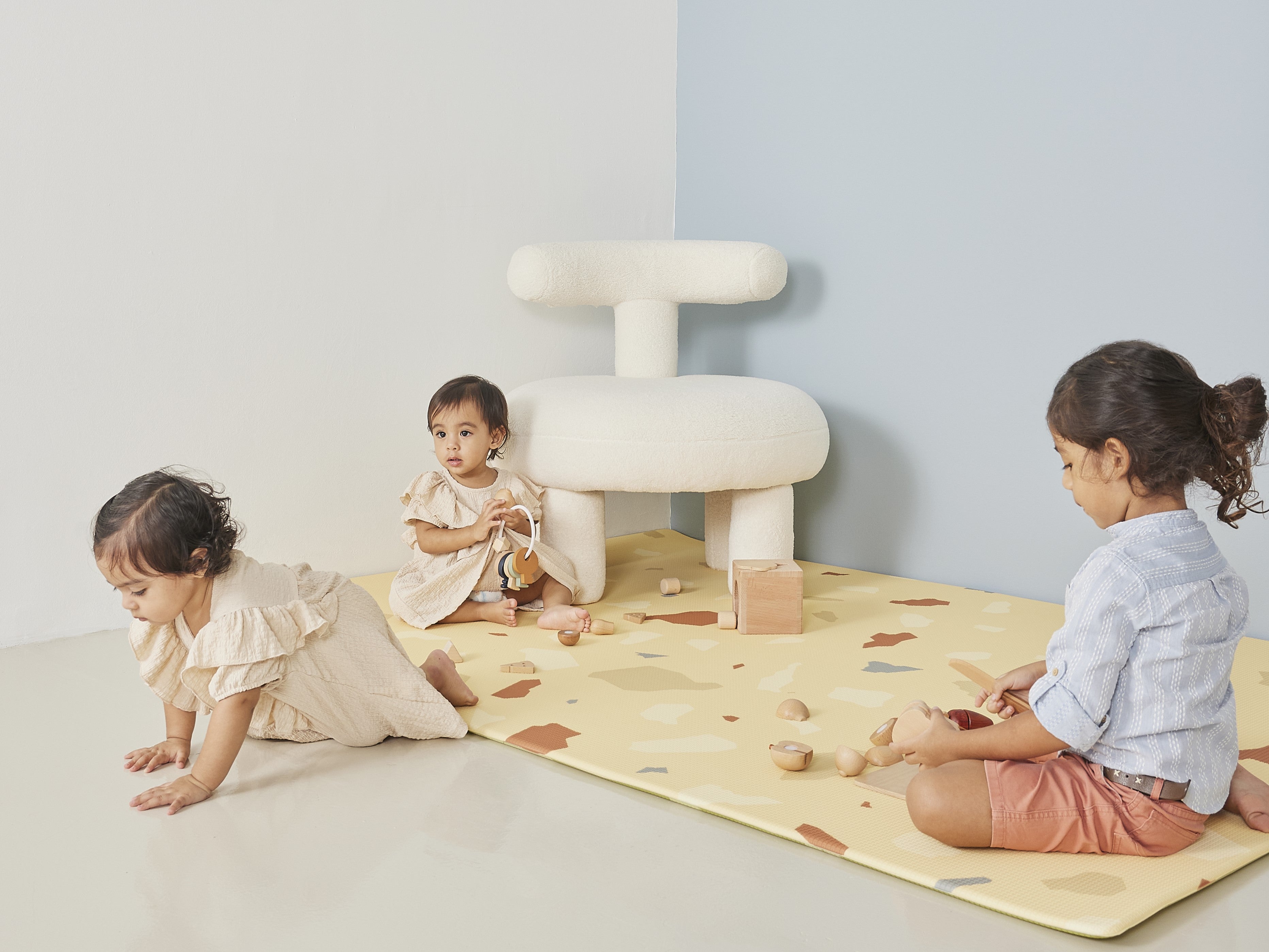 three girls playing on lollibly terrazzo play mat