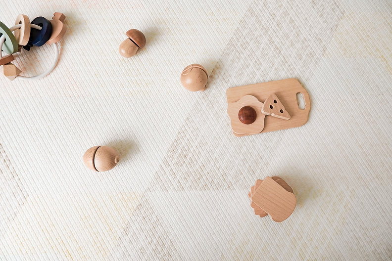 wooden toys on lollibly sand dune playmat