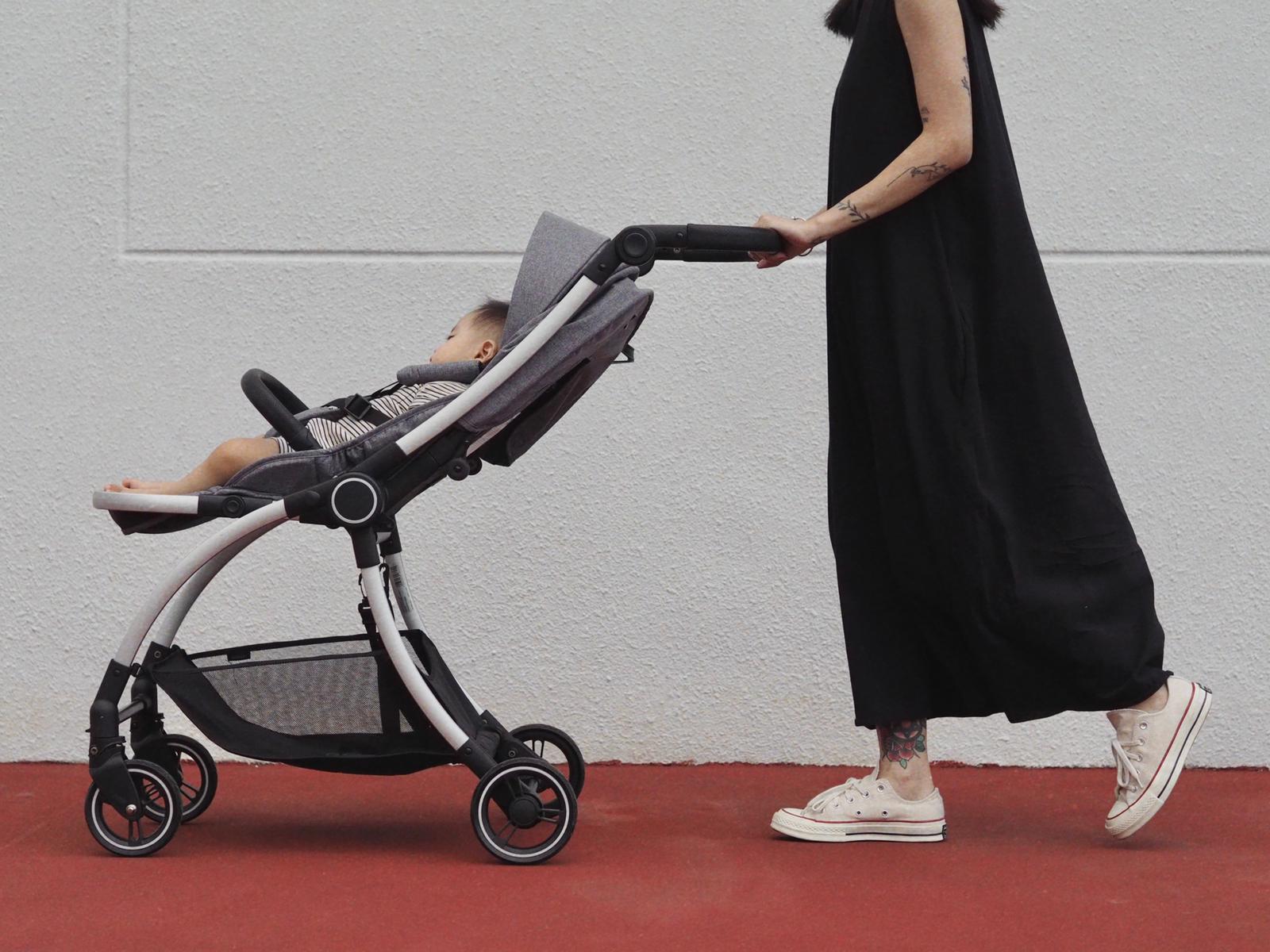 mum pushing baby in hauck eagle colibri stroller
