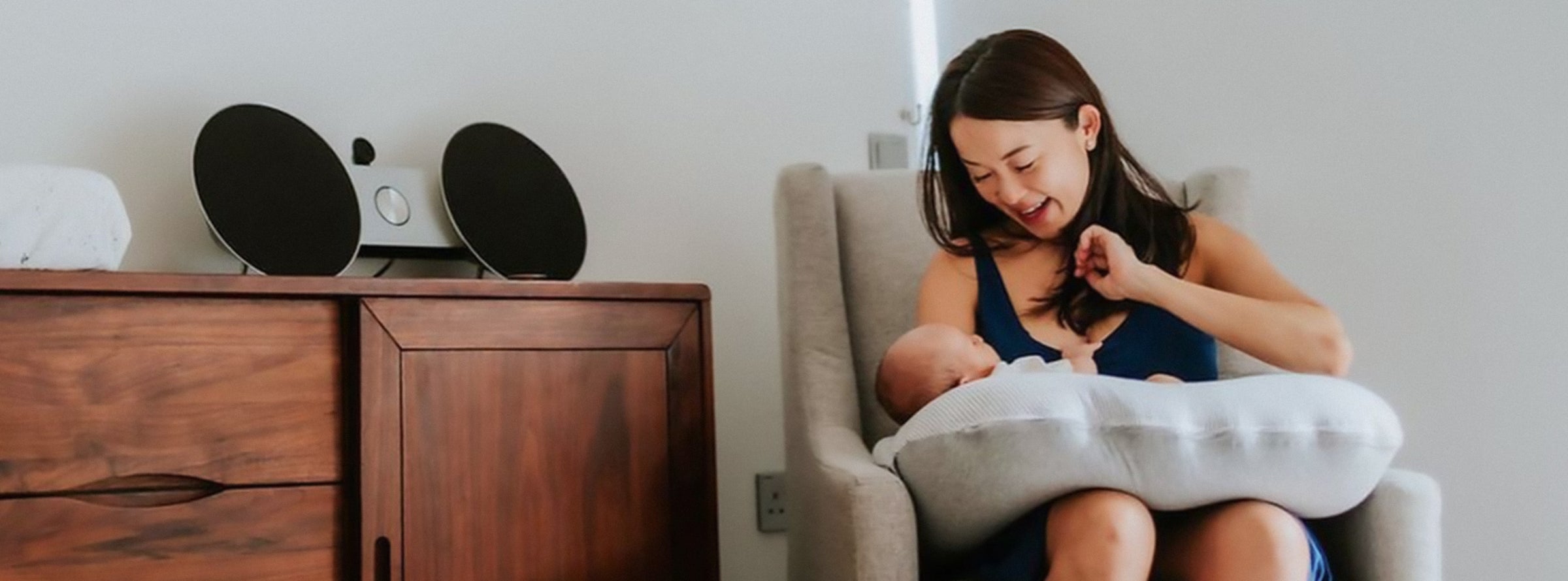 mother feeding nursing baby