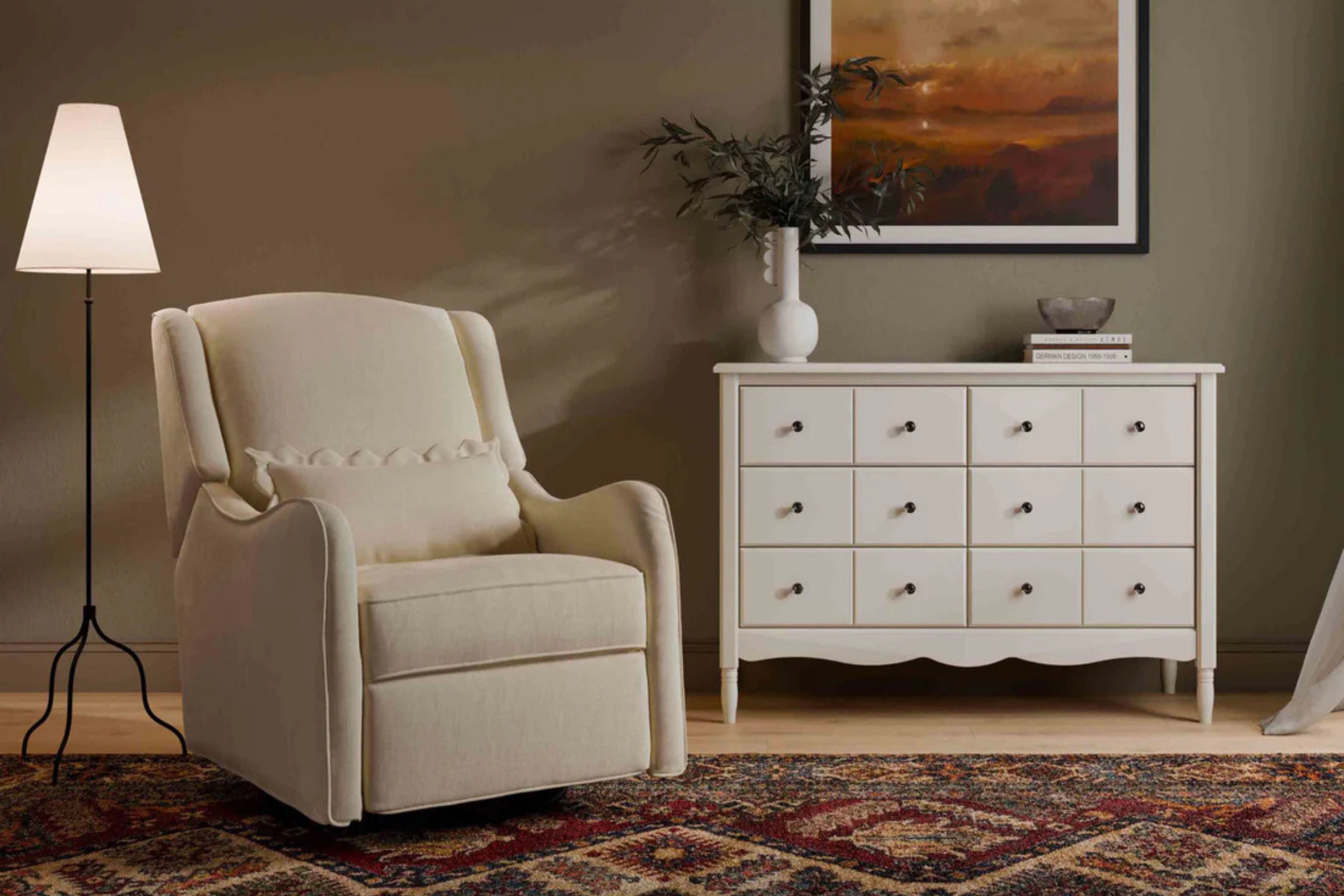 Devon Recliner and Swivel Glider Nursing Chair in Cream, styled in a dark, modern mid-century nursery #color_cream