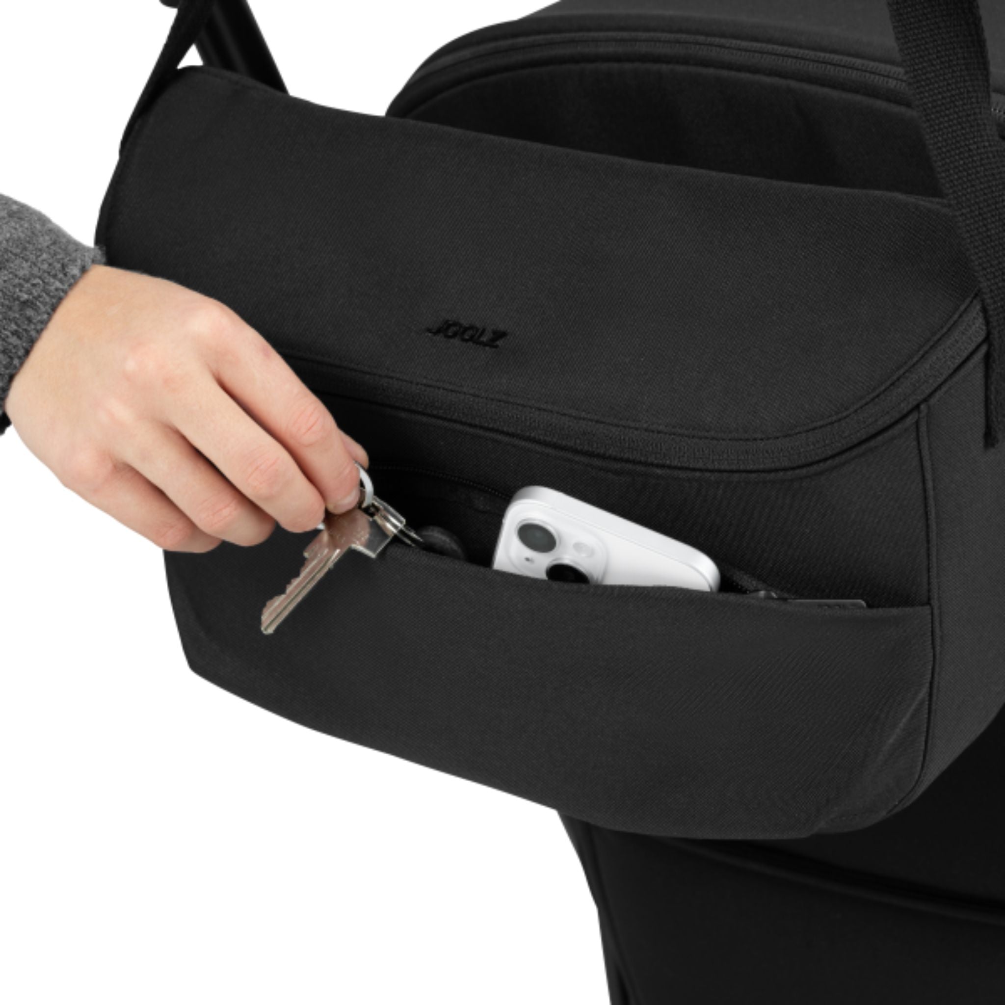 Joolz Organizer in Space Black attached to a stroller, filled with baby essentials and everyday items #color_space-black