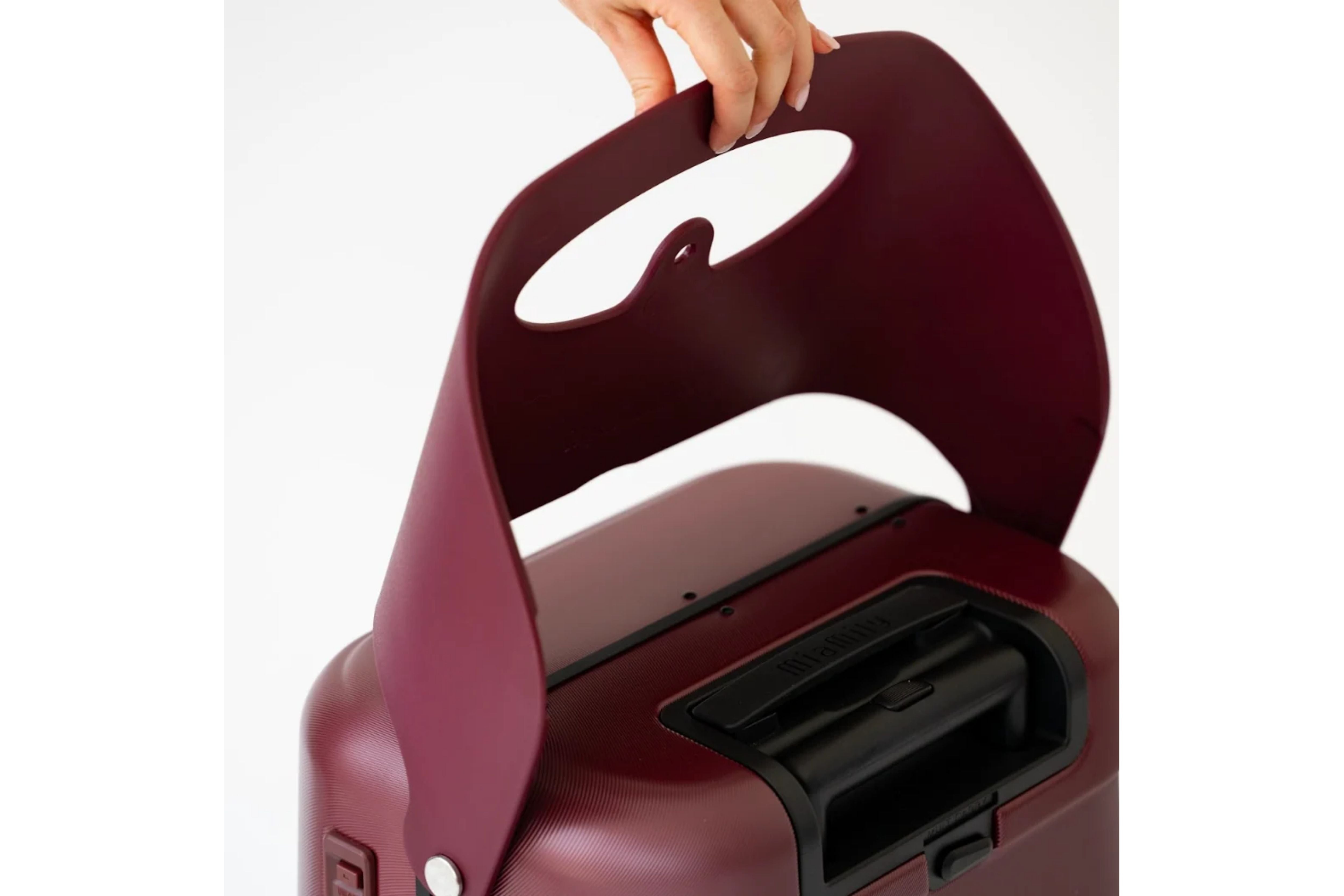 Close-up of the MiaMily Carry On Plus 18” Luggage’s built-in ride-on seat
