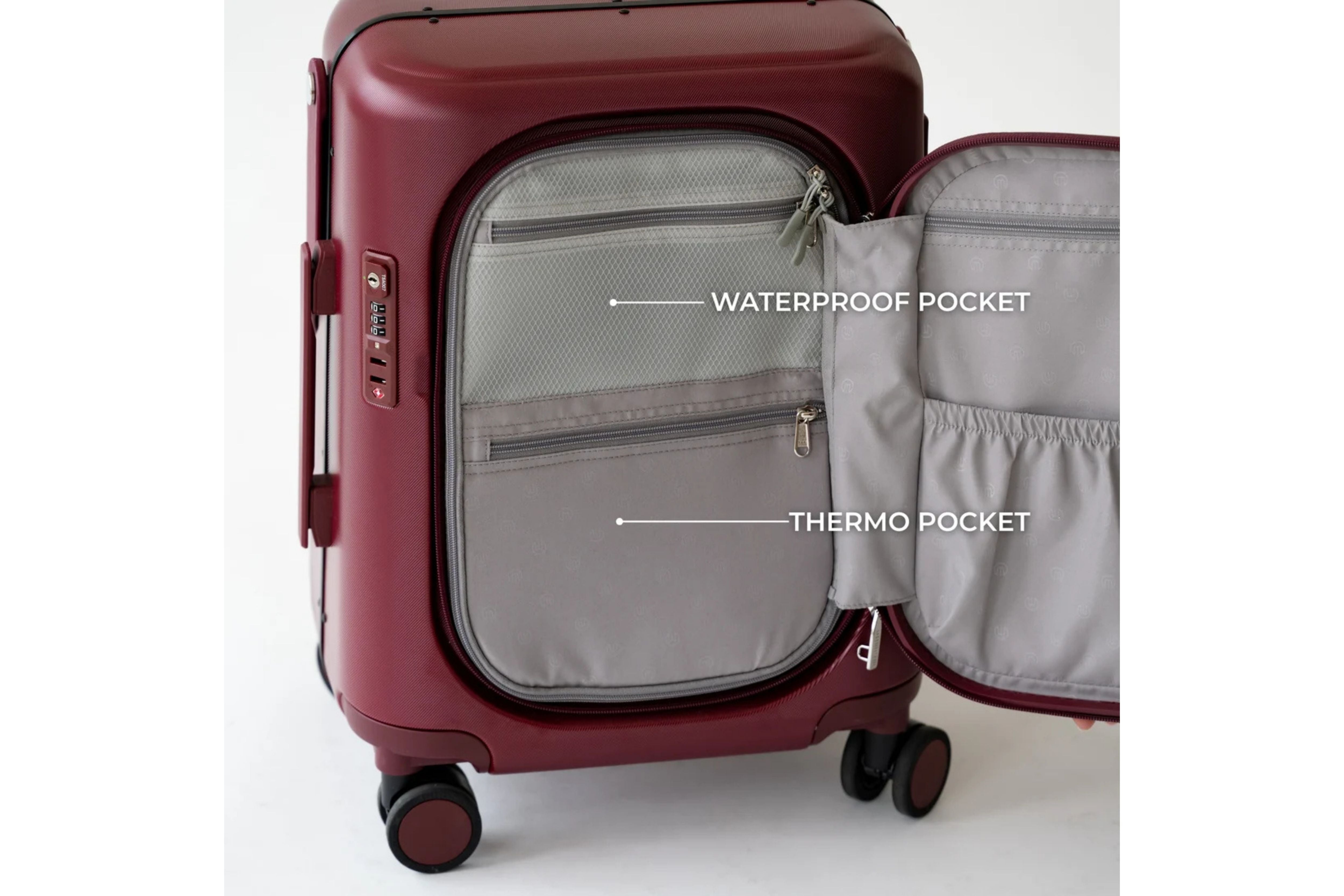 The MiaMily Carry On Plus 18” Luggage with its front compartment open, showing its interior waterproof pocket and thermo pocket