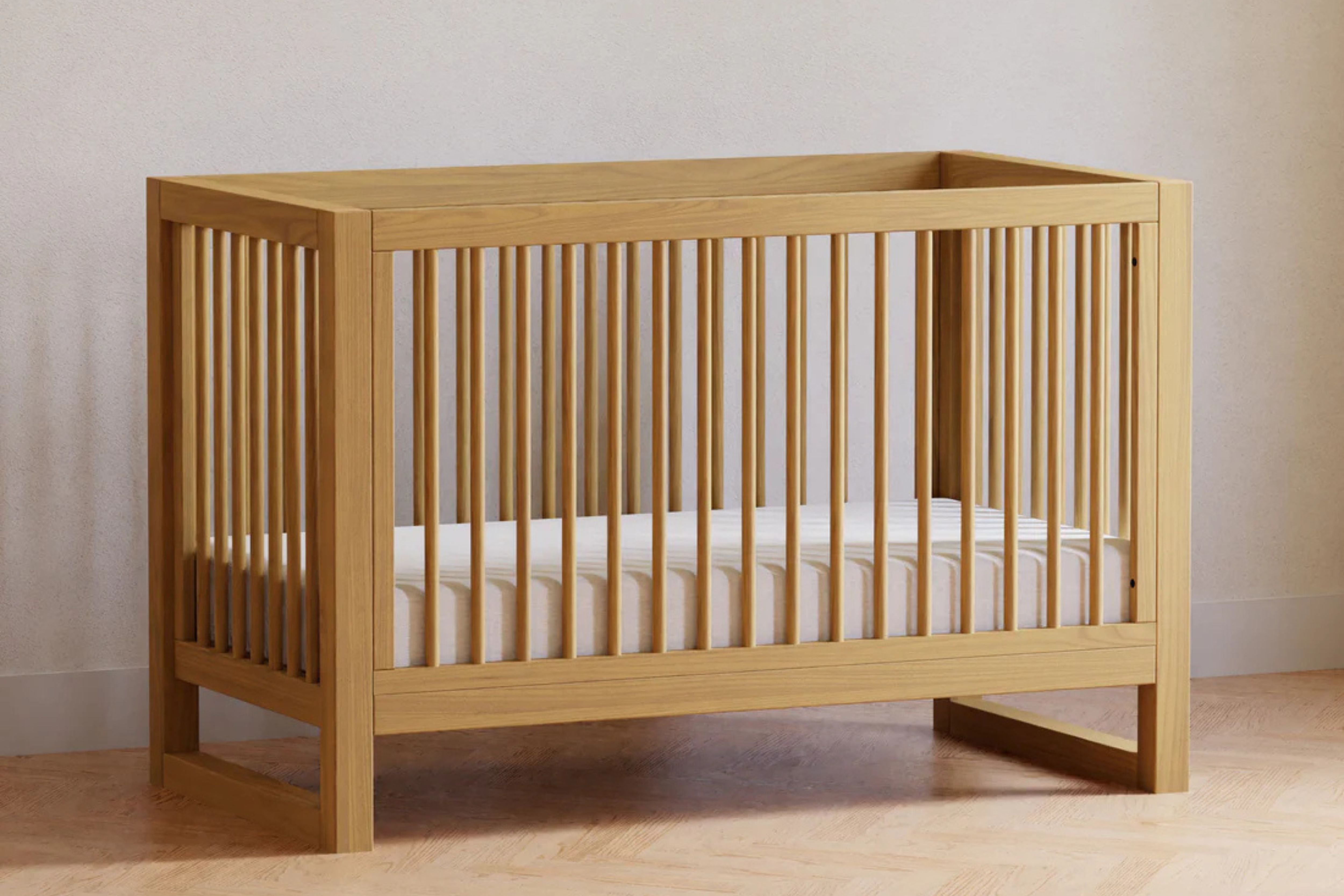 Namesake Nantucket 3-in-1 Convertible Crib in Honey finish styled as a toddler bed using the included toddler bed conversion kit #color_honey