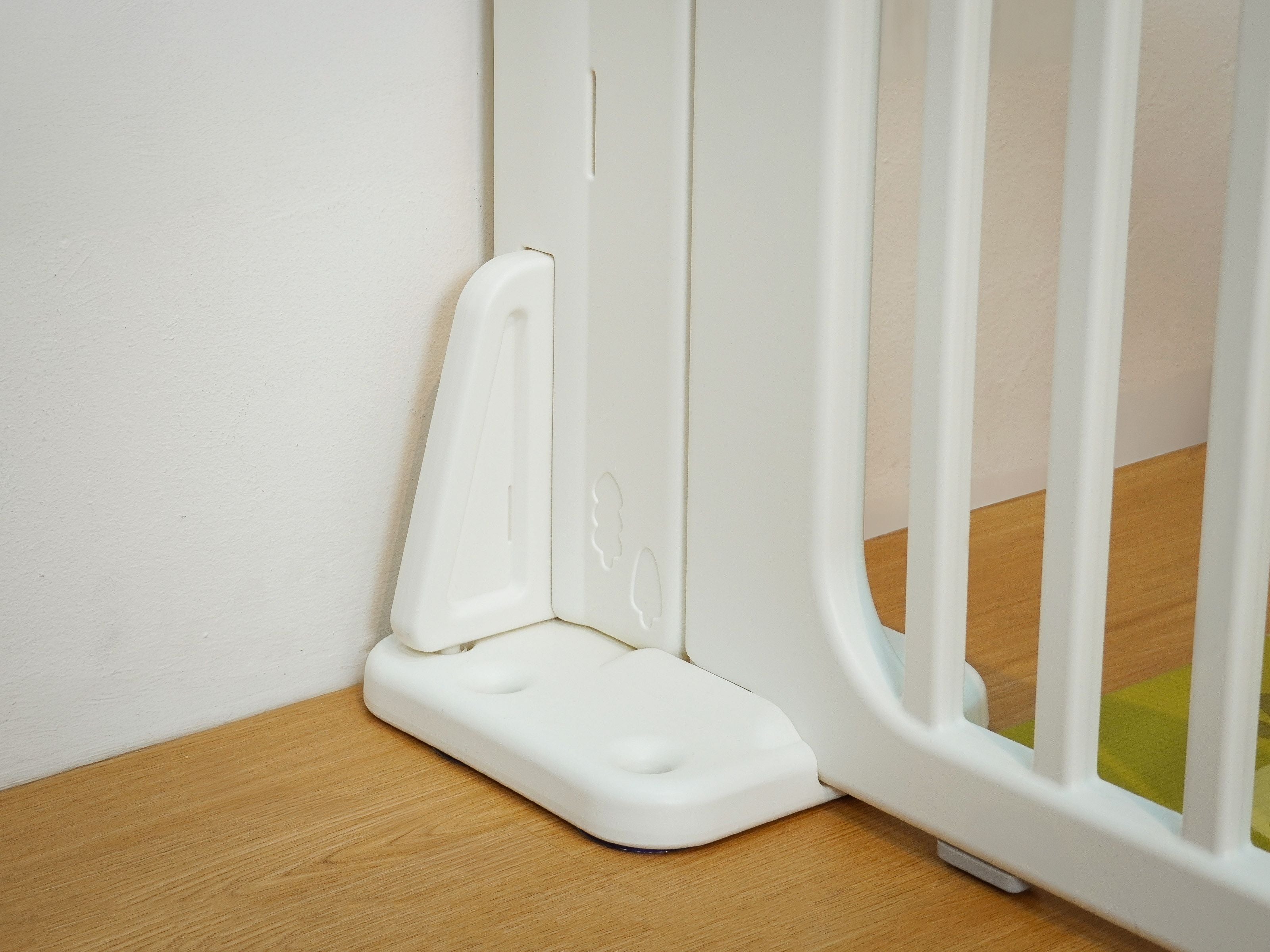 Lollibly Flexi-frame Stand securely holding a panel of the Meadow Playpen in place