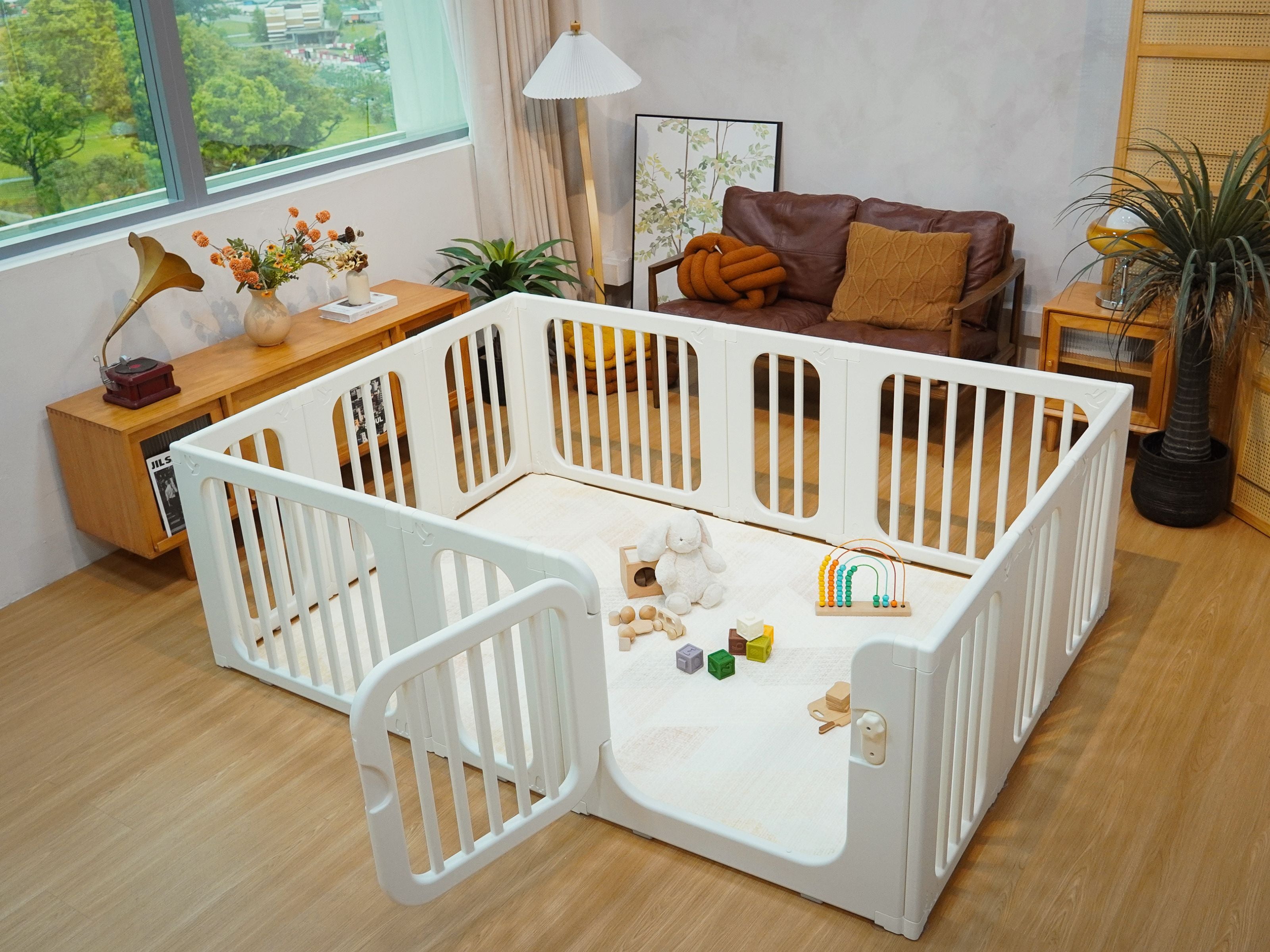 Lollibly Meadow Playpen placed in the middle of a cosy living room setting