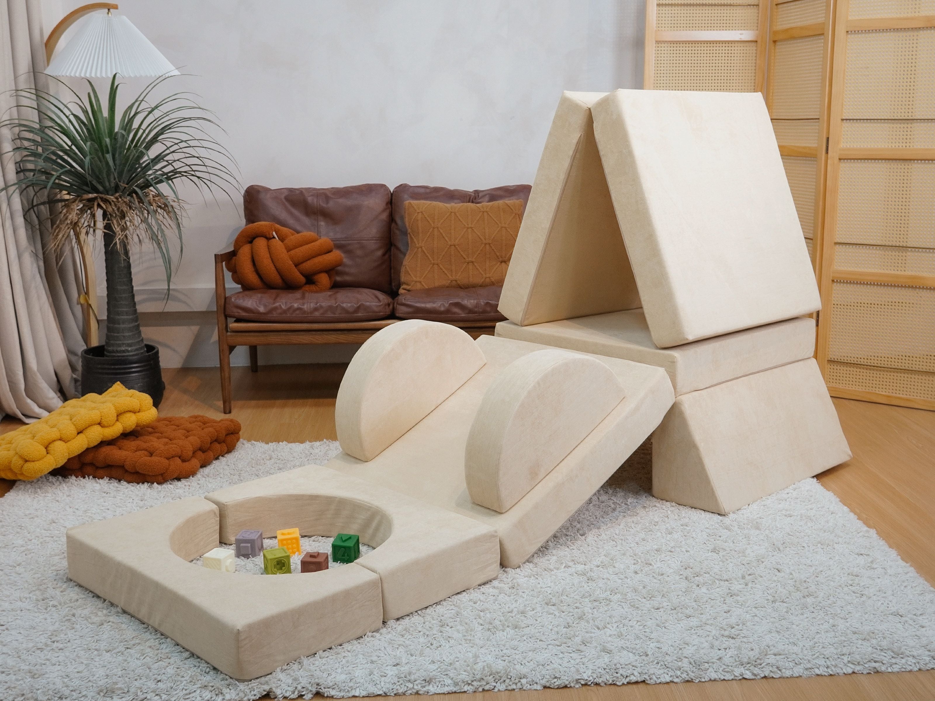 Lollibly Wonderstack Play Sofa arranged in a different kind of configuration, mimicking a tent with a mini slide