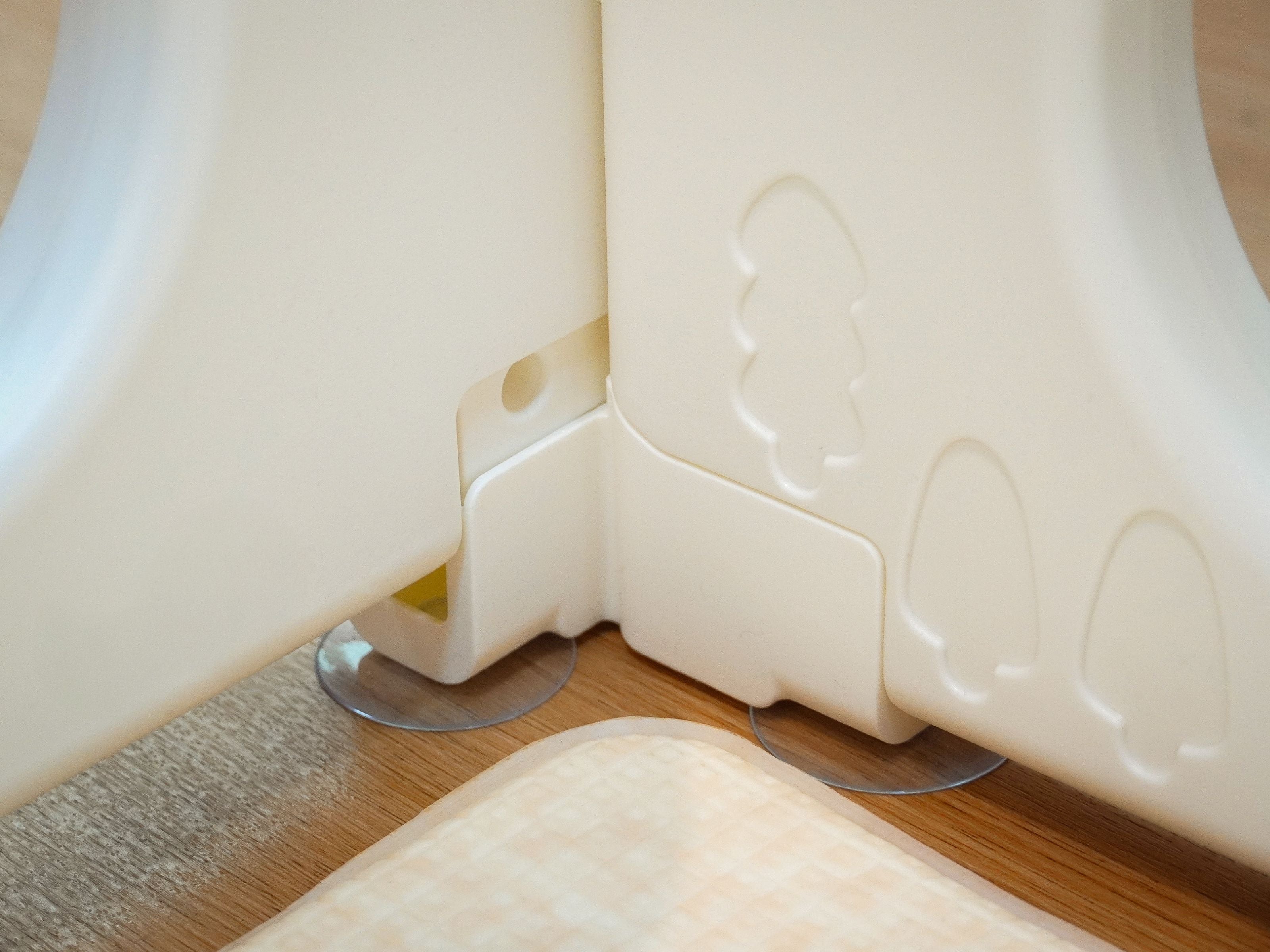 Zoomed in details of the Lollibly Playpen's suction cup base