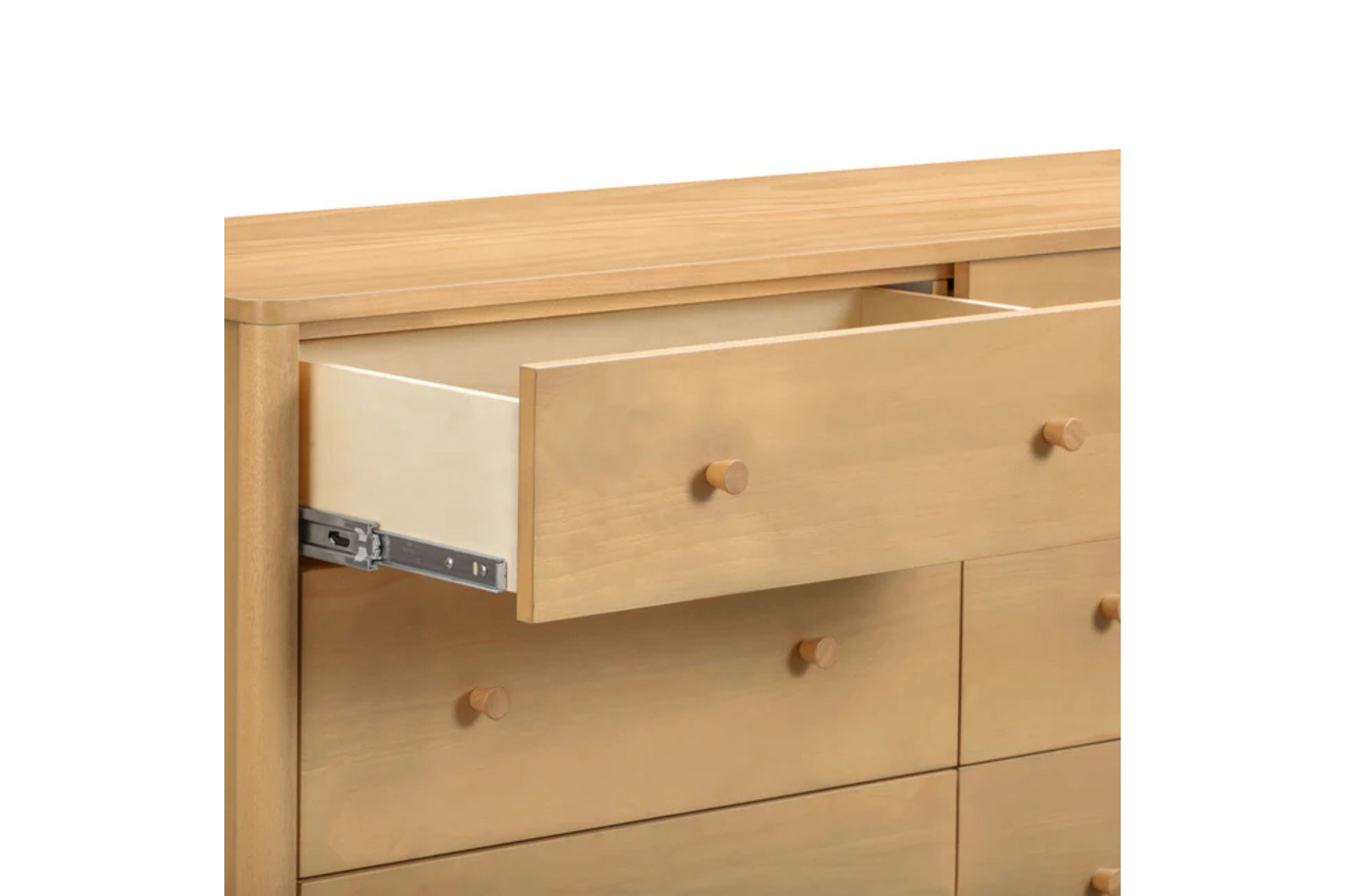 Close-up detail of the Babyletto Swell 6-Drawer Assembled Dresser #color_honey