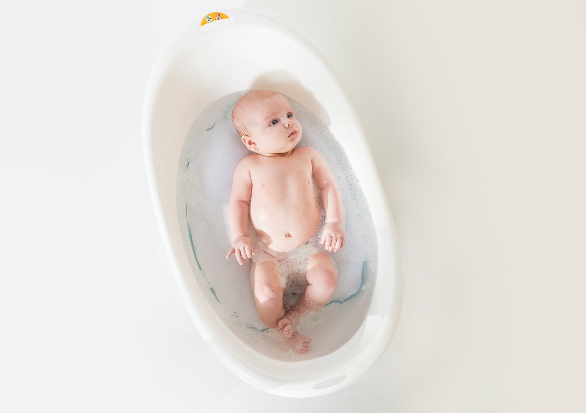 baby using bath tub with doomoo comfy bath