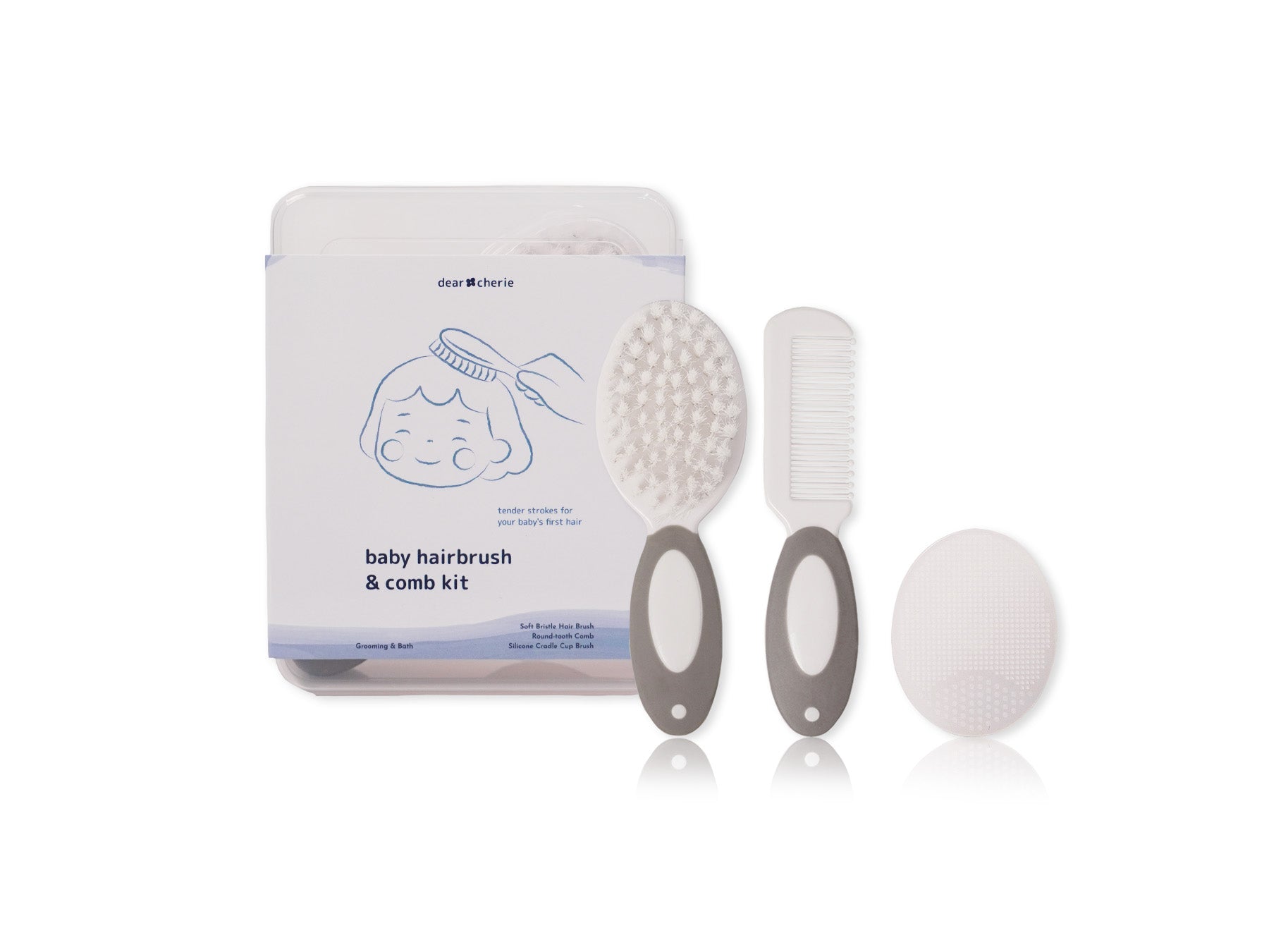 Baby hairbrush and comb kit with packaging on a white background