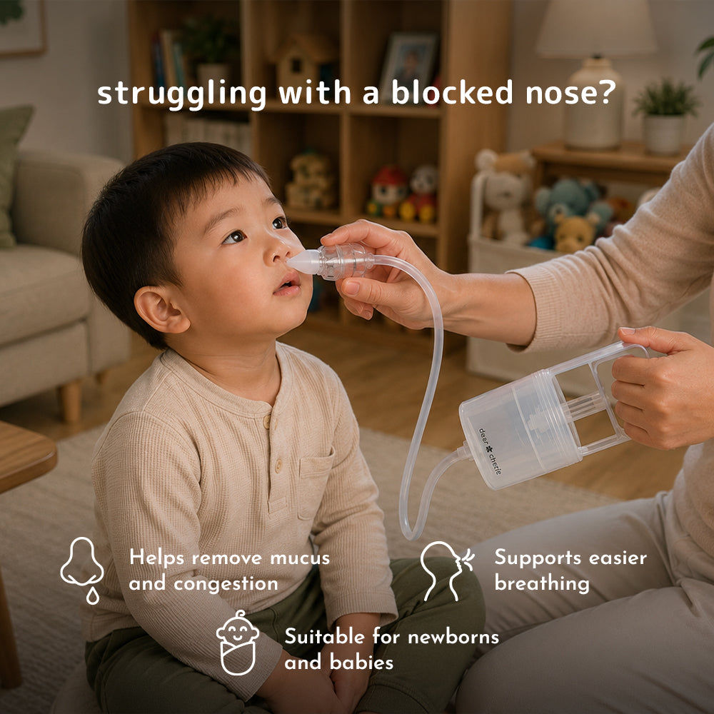 A parent uses the Dear Cherie Hand Pump Nasal Aspirator on a toddler, in a living room setting.