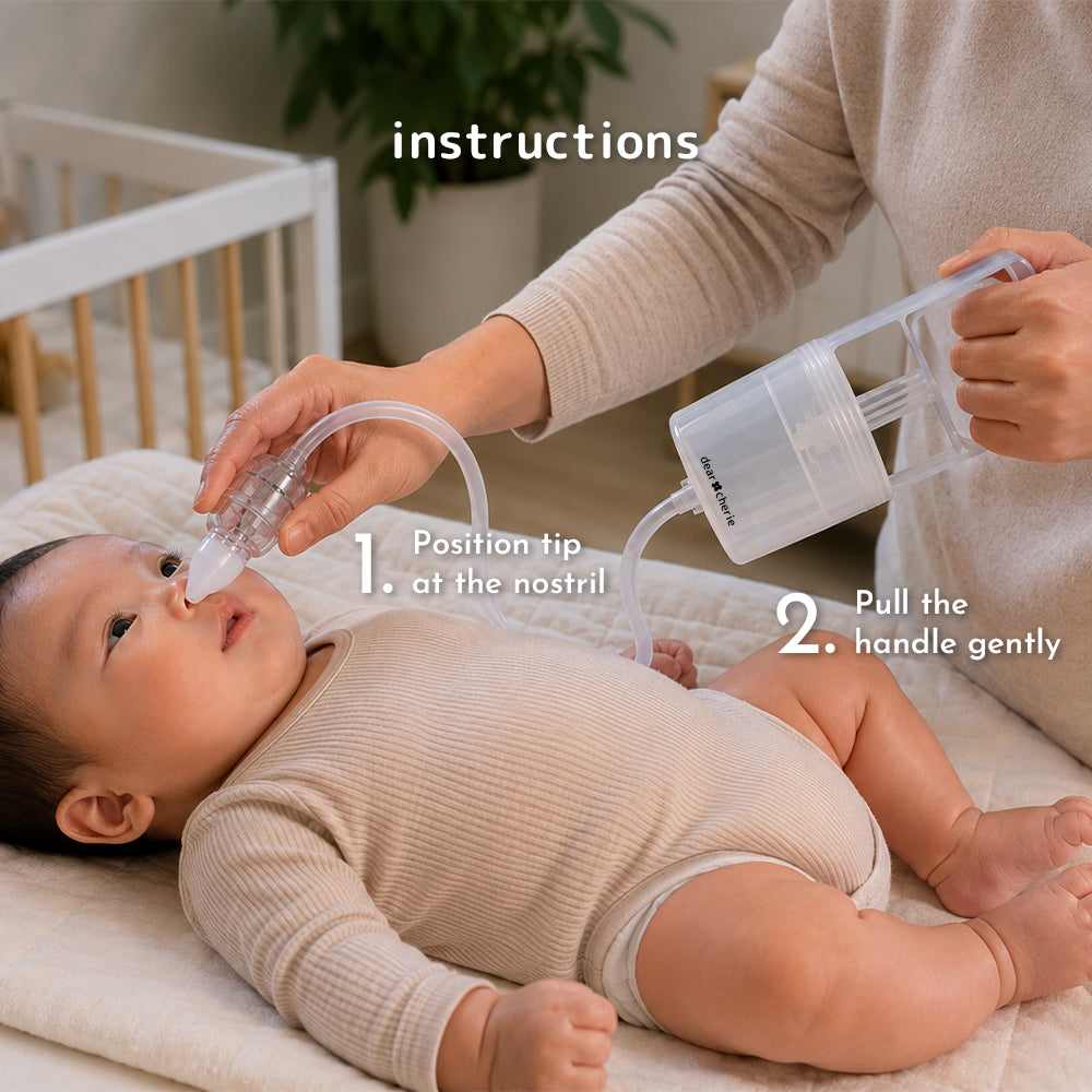 Step-by-step demonstration of the Dear Cherie Hand Pump Nasal Aspirator on a baby. The silicone tip is positioned at the nostril while the parent gently pulls the handle to create suction.