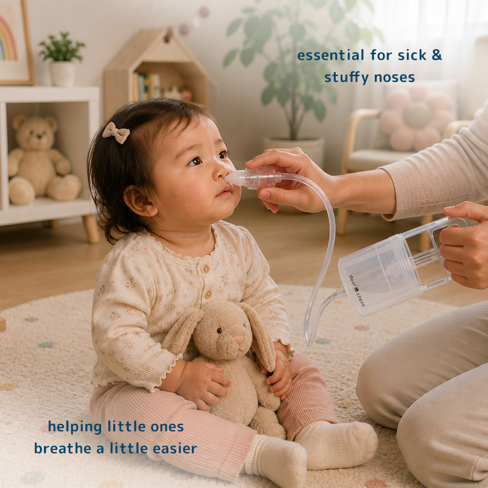 A parent uses the Dear Cherie Hand Pump Nasal Aspirator on a young child.