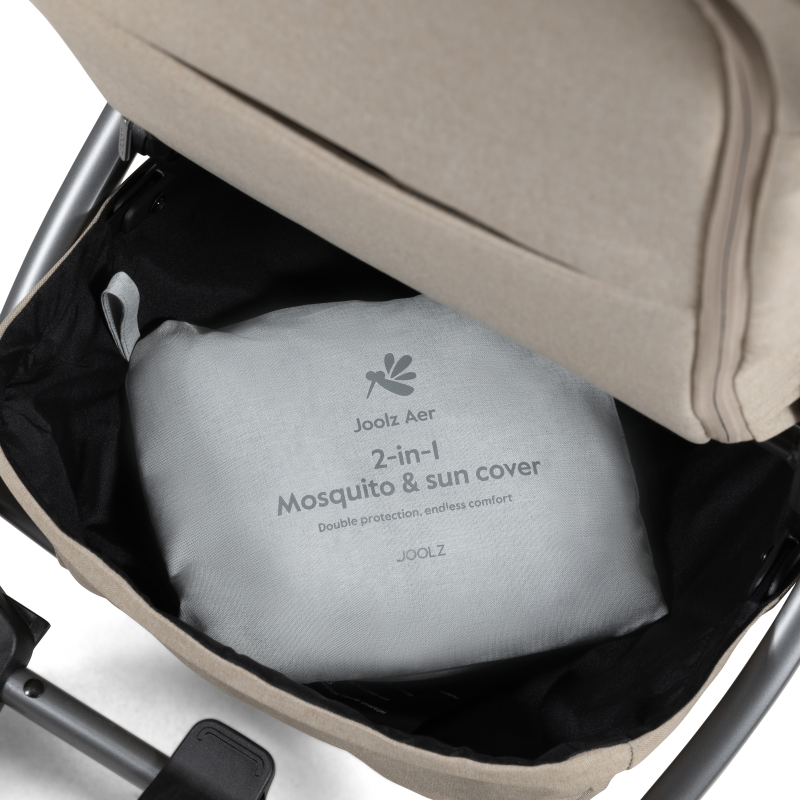 joolz aer baby stroller mosquito and sun cover folded in bag placed in stroller basket