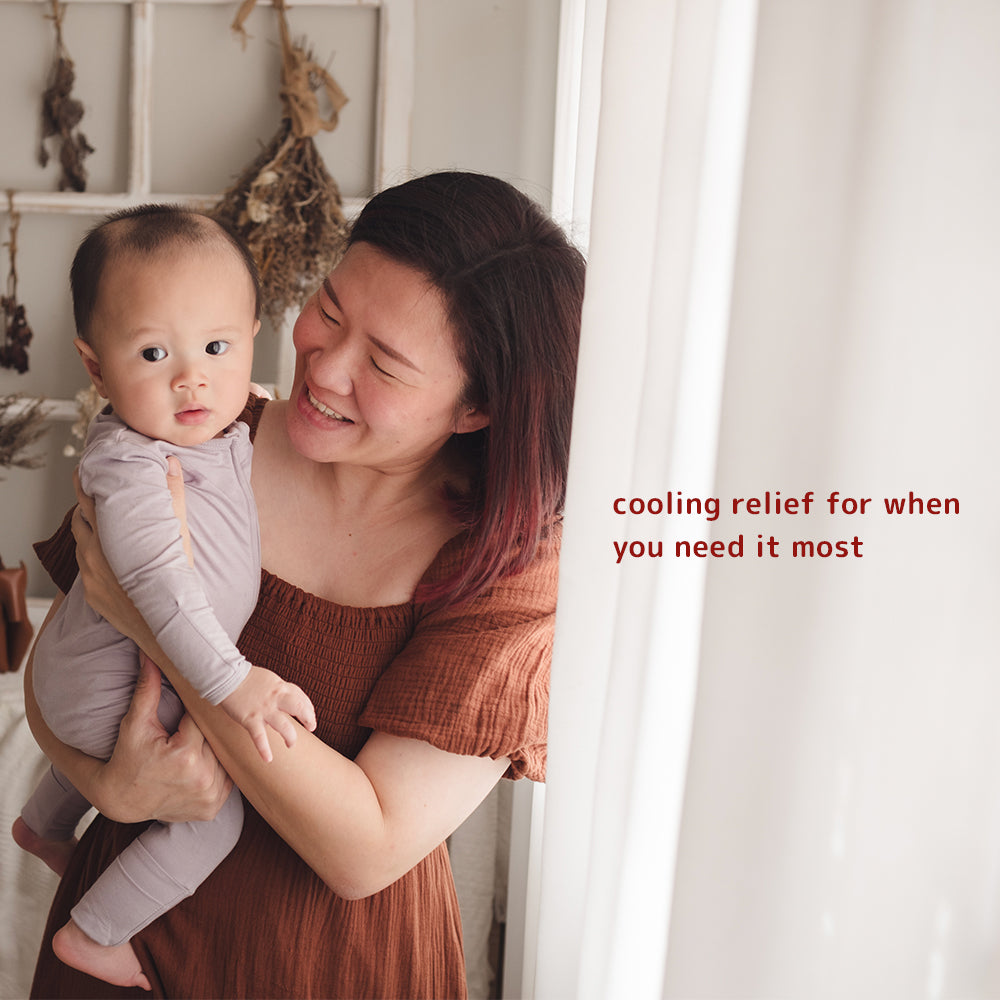 Woman holding a baby, with supportive text graphic about Dear Cherie instant cold perineal pads providing cooling relief for postpartum recovery