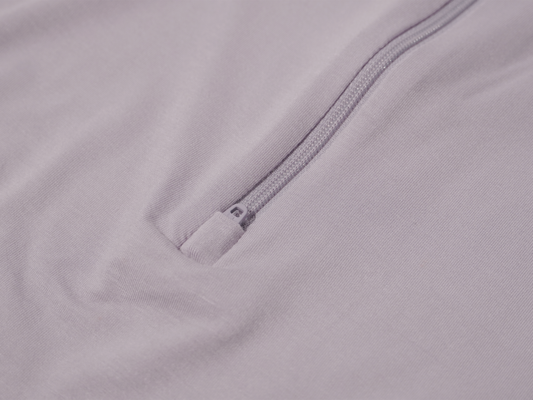 Close-up of Lollibly lavender swaddle bag hidden zipper