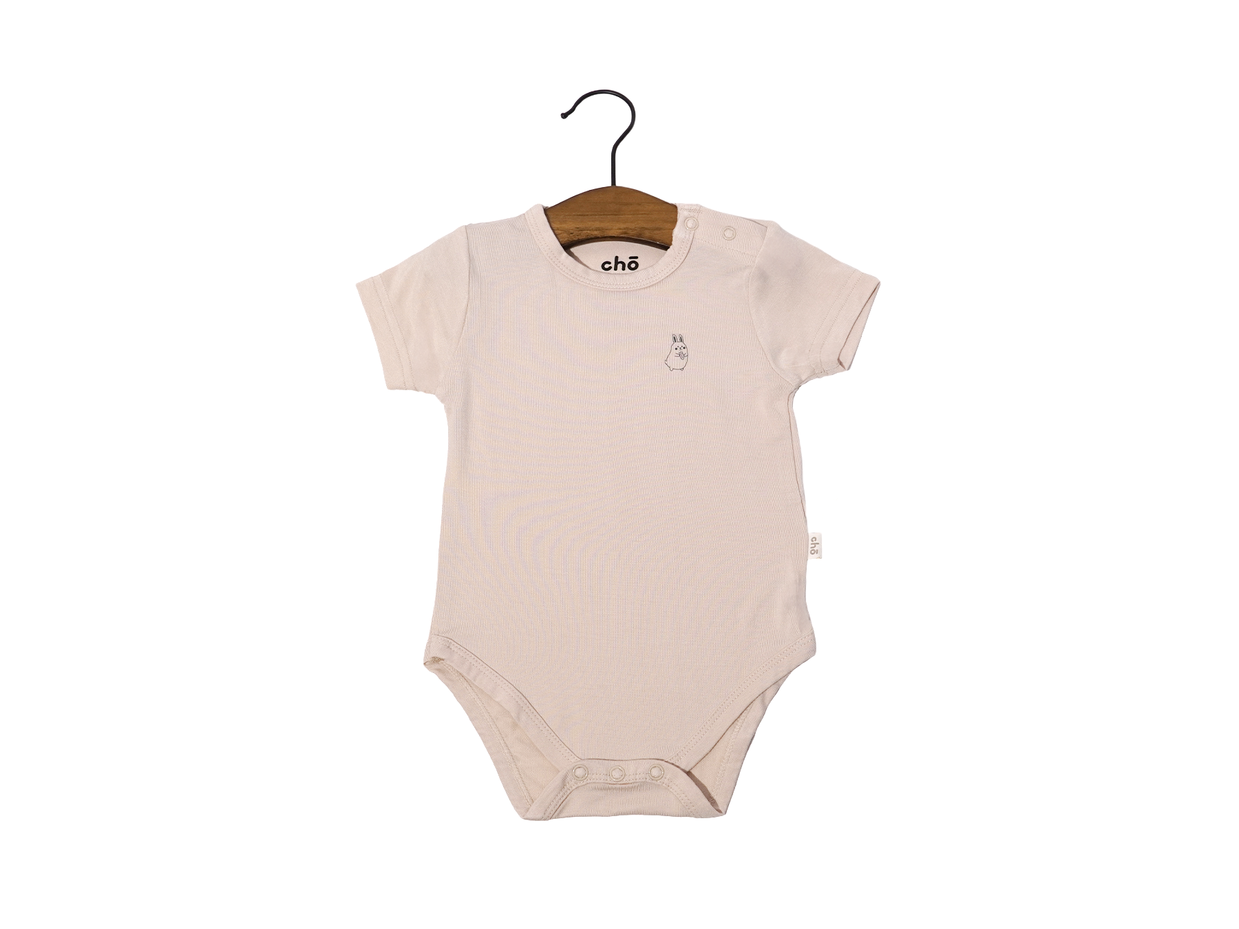 Beige sand baby onesie on a hanger