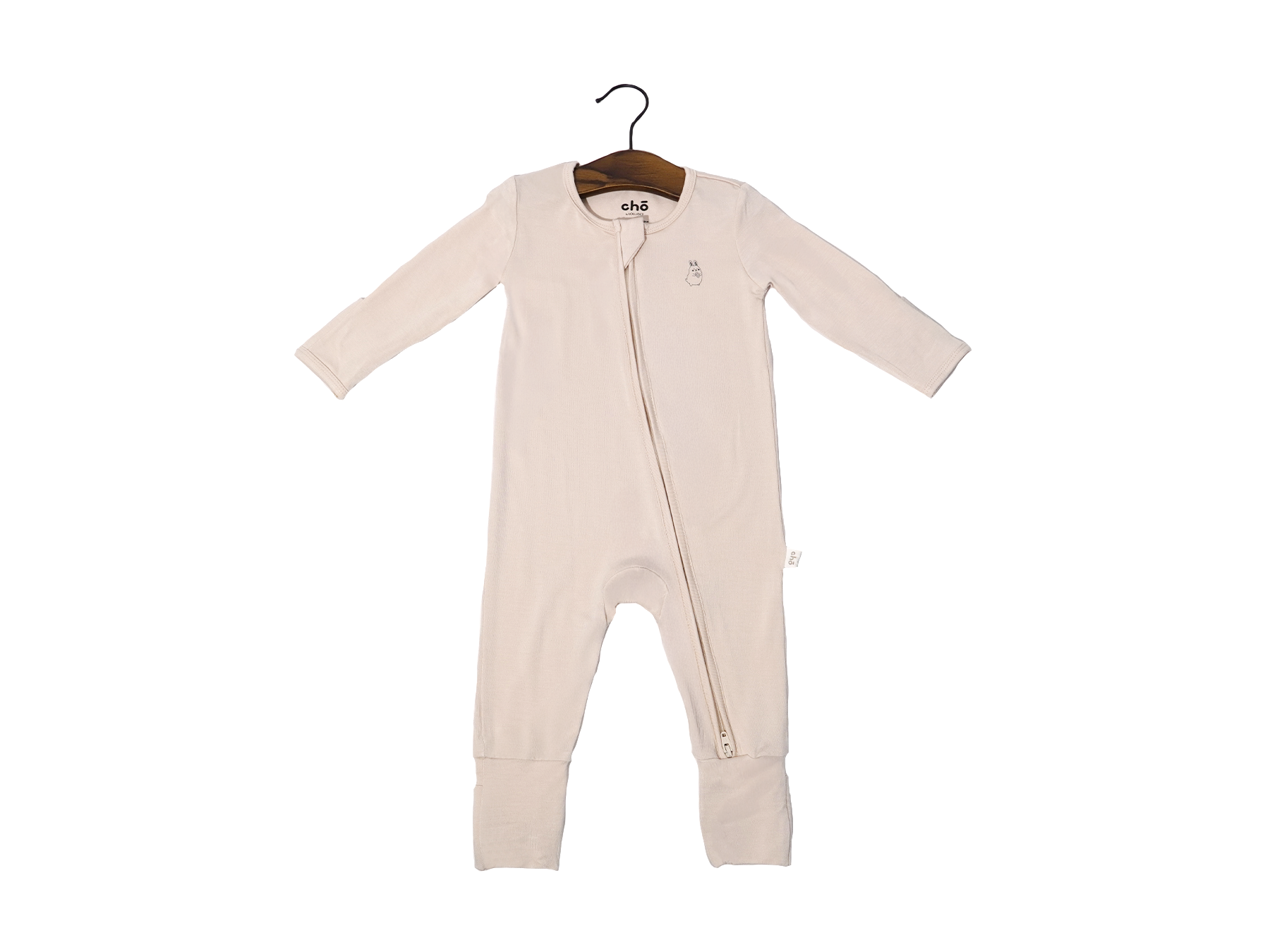 Beige sand baby sleep suit on a hanger