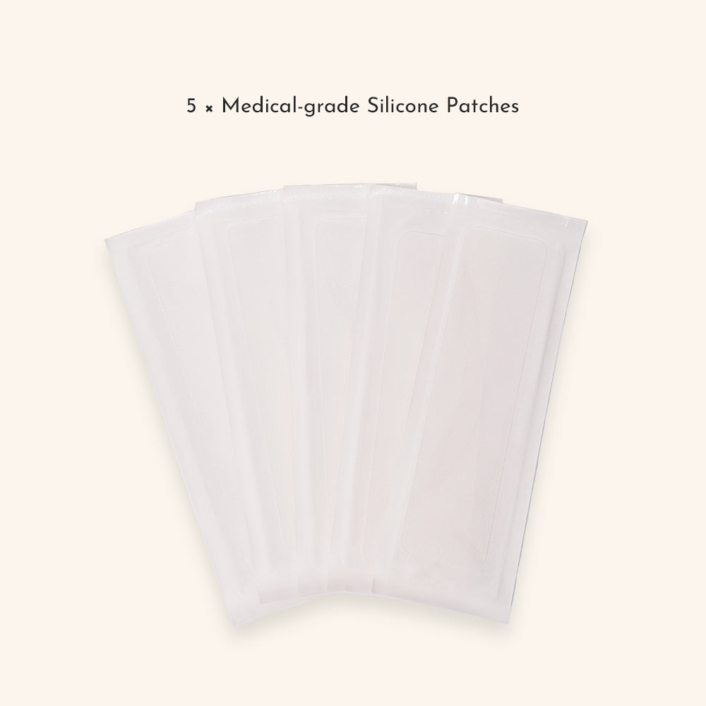 Flat lay of five medical-grade silicone patches