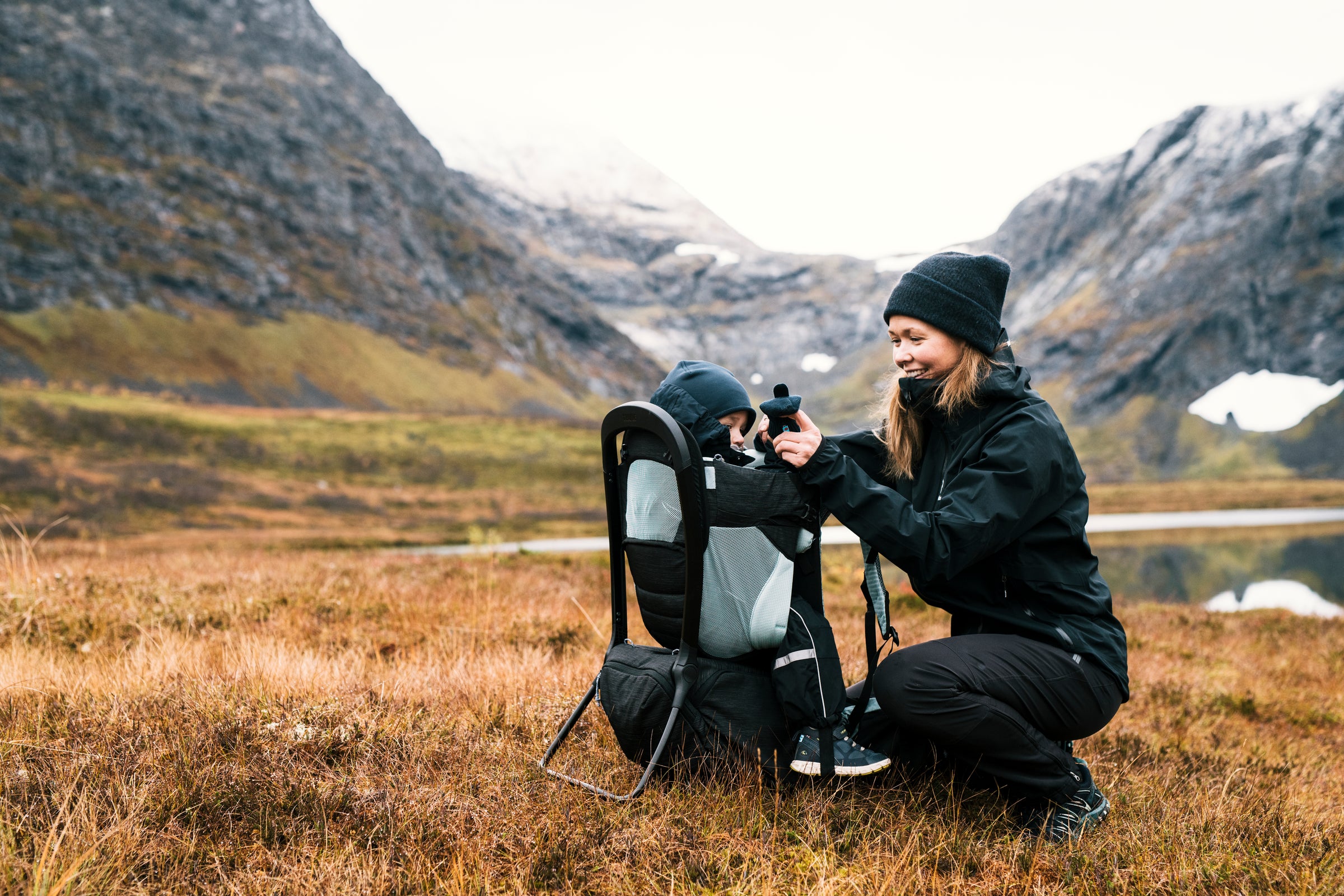 happy mum and child on adventure in nature with Thule Child Carrier Backpack Sapling