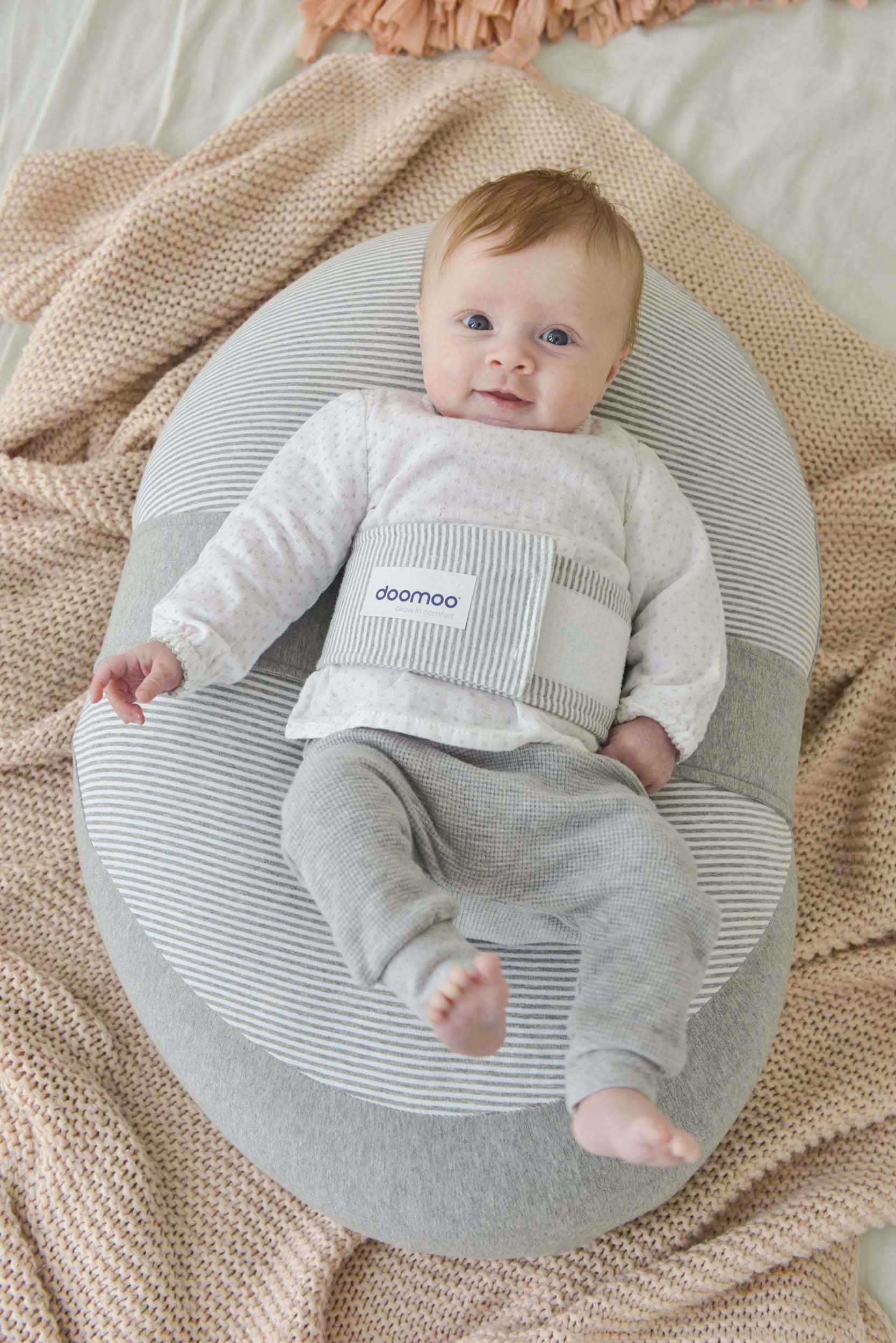 baby on doomoo buddy with classic grey relax cover