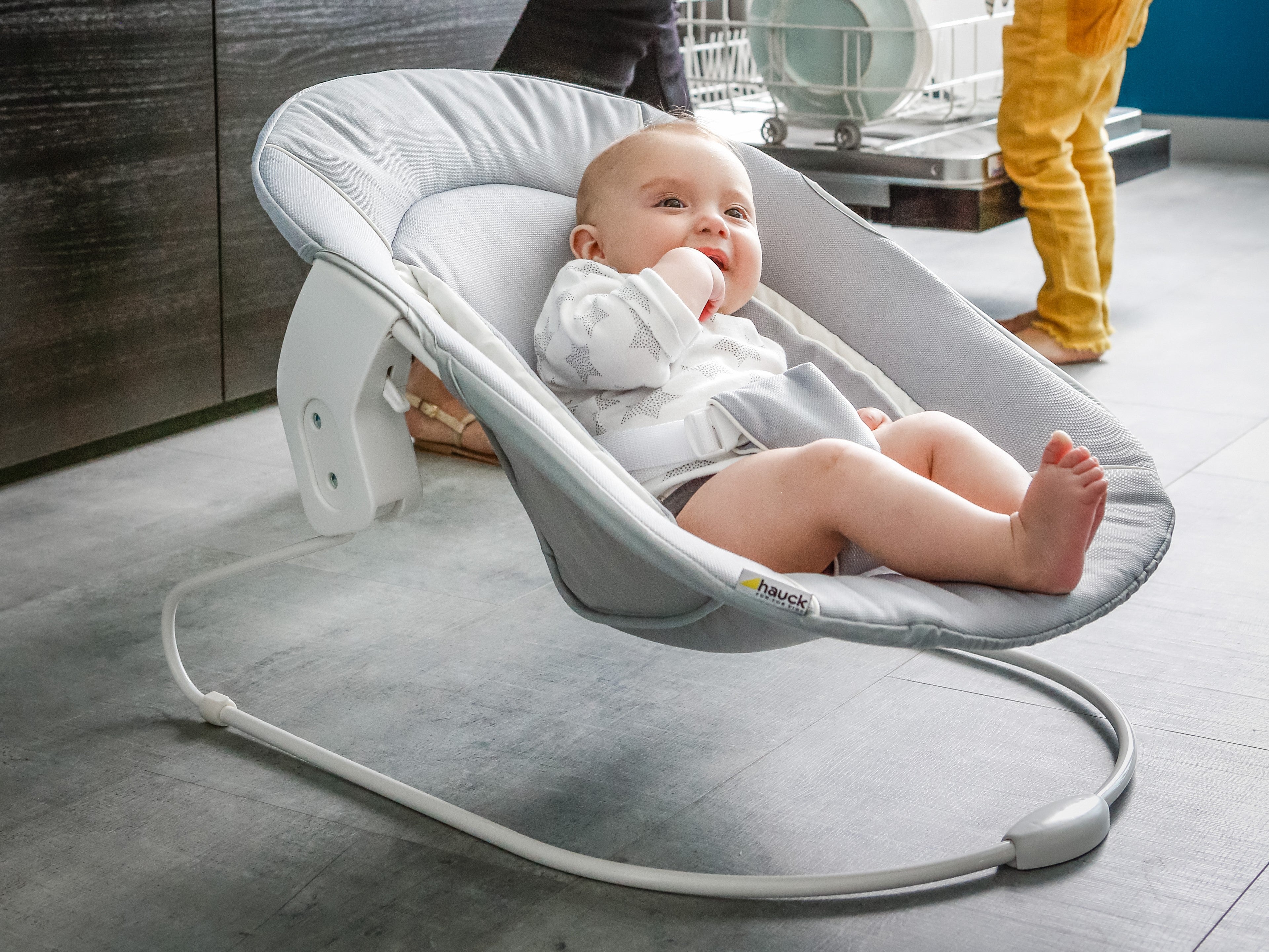 baby on hauck alpha bouncer attached to metal attachment