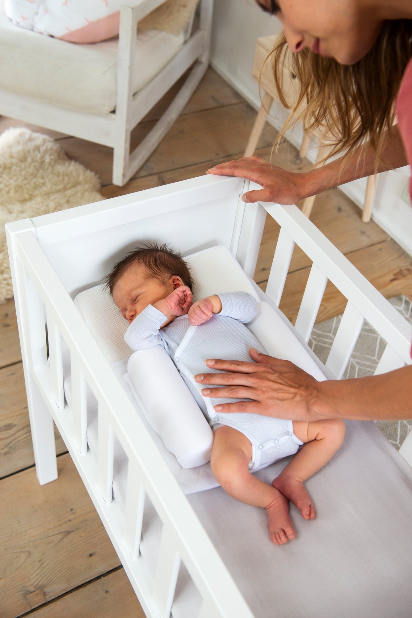 baby in crib with doomoo supreme sleep small
