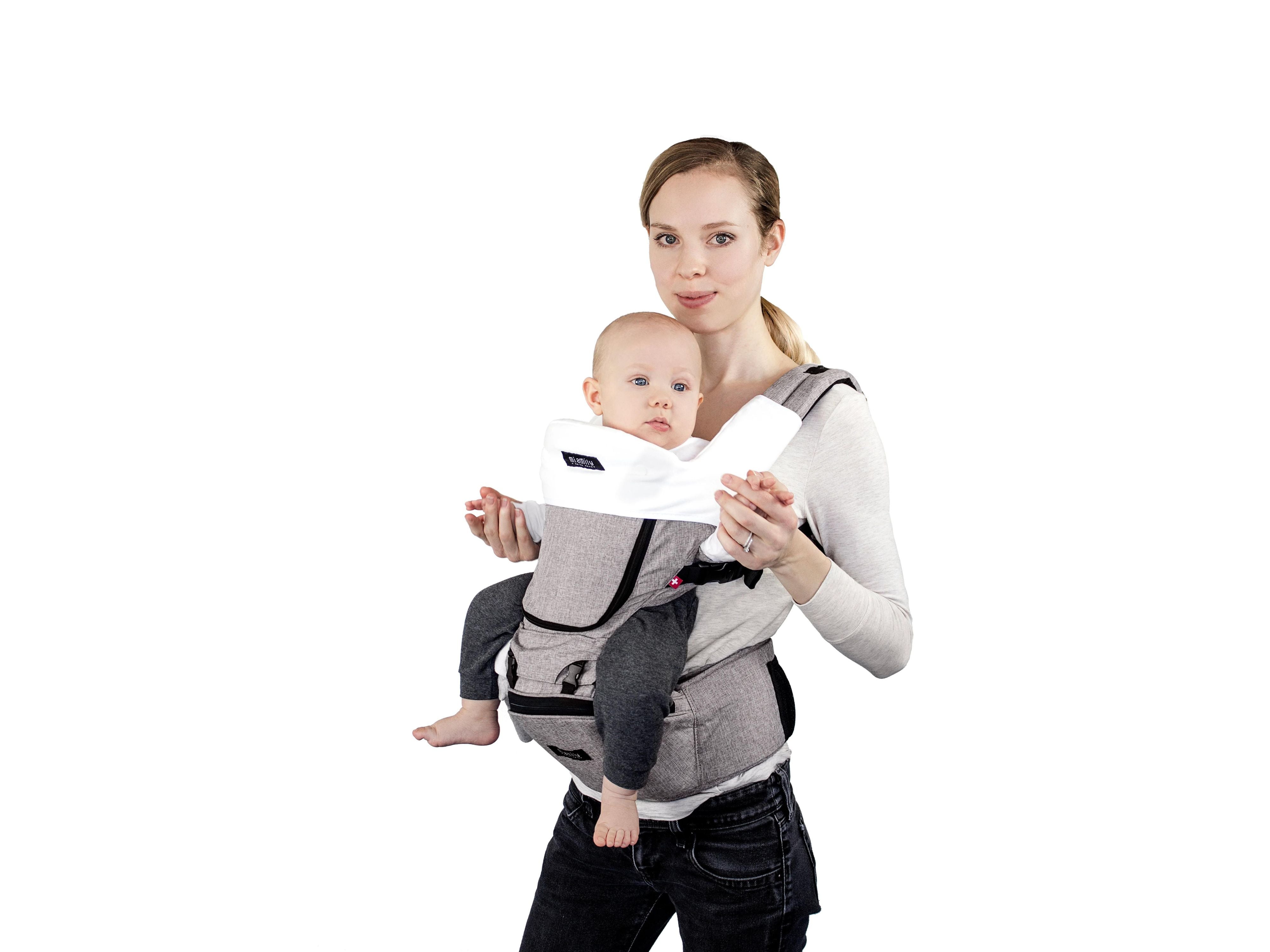 mom carrying baby in hipster plus carrier with drool pad